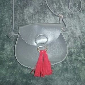 Small grey purse with red tassels